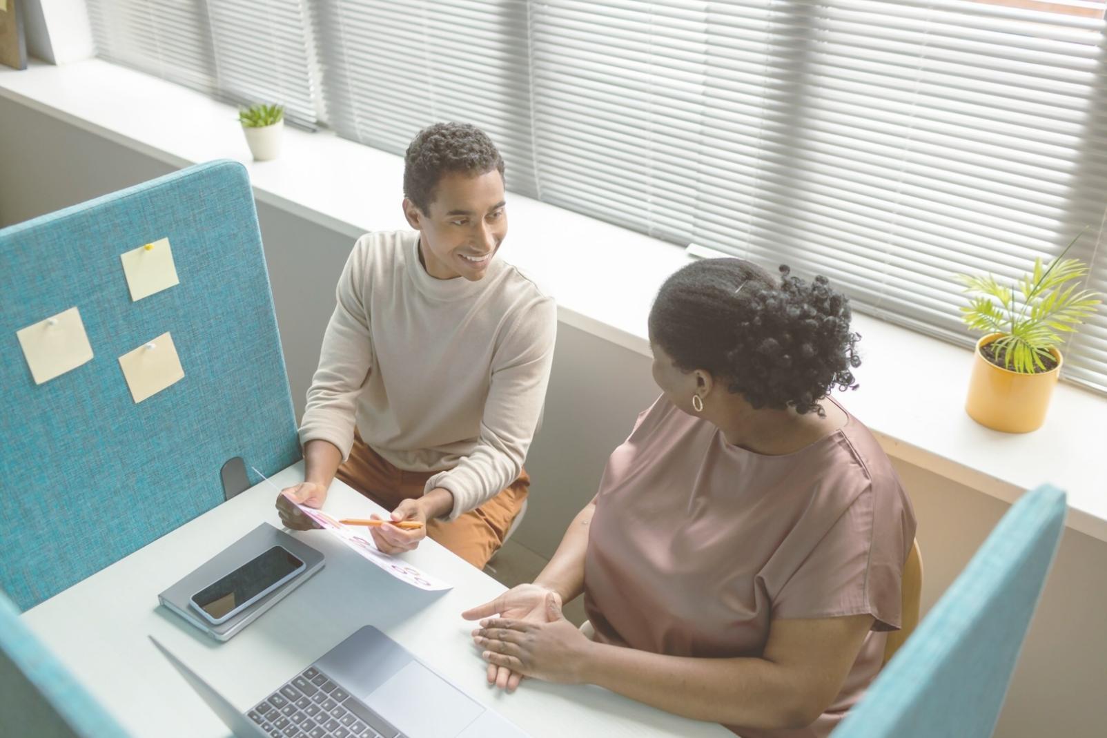 Instructor reviewing student market assessment work